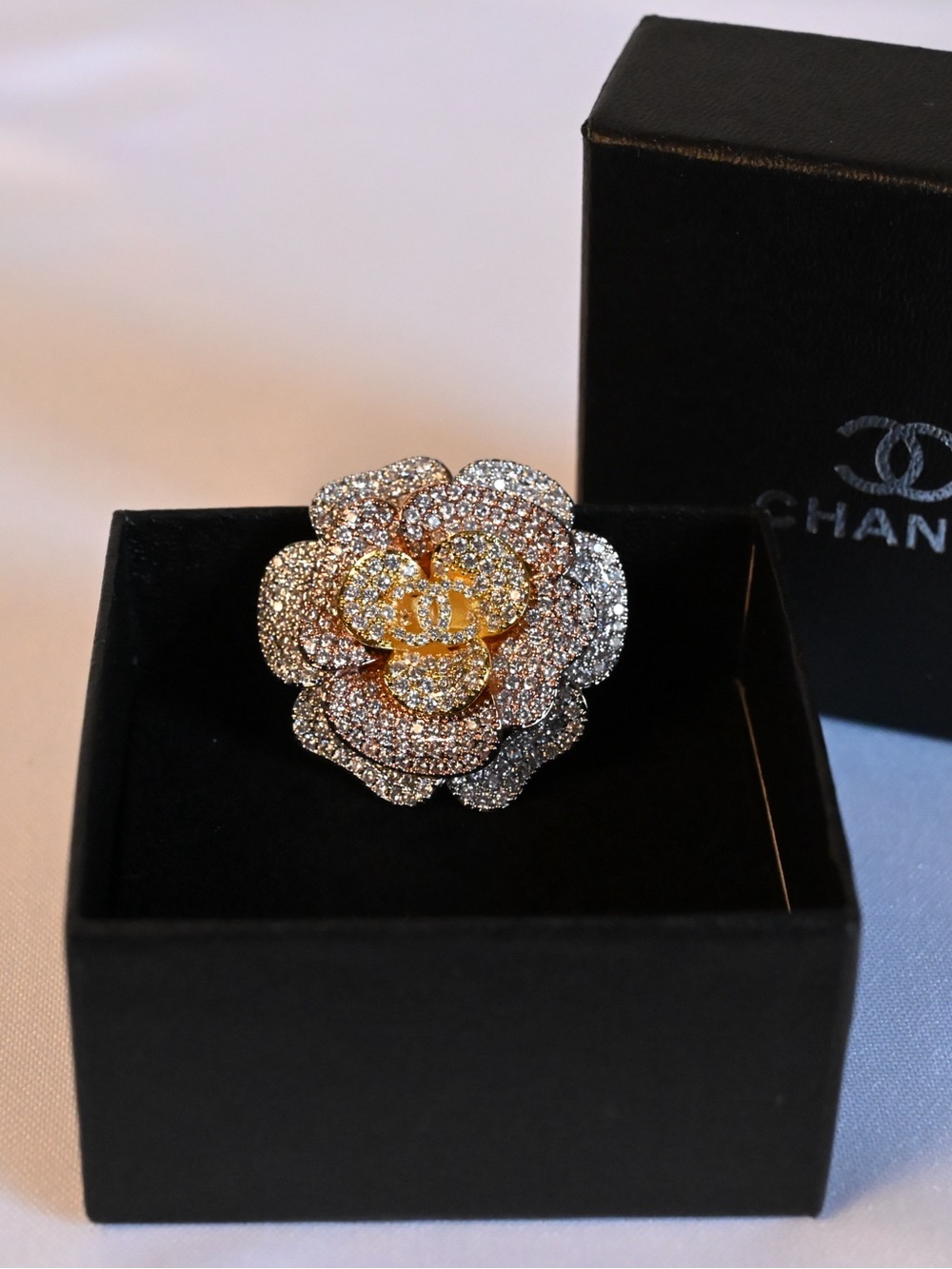 CHANEL Two-Tone Crystal Camellia Brooch in Gold and Silver